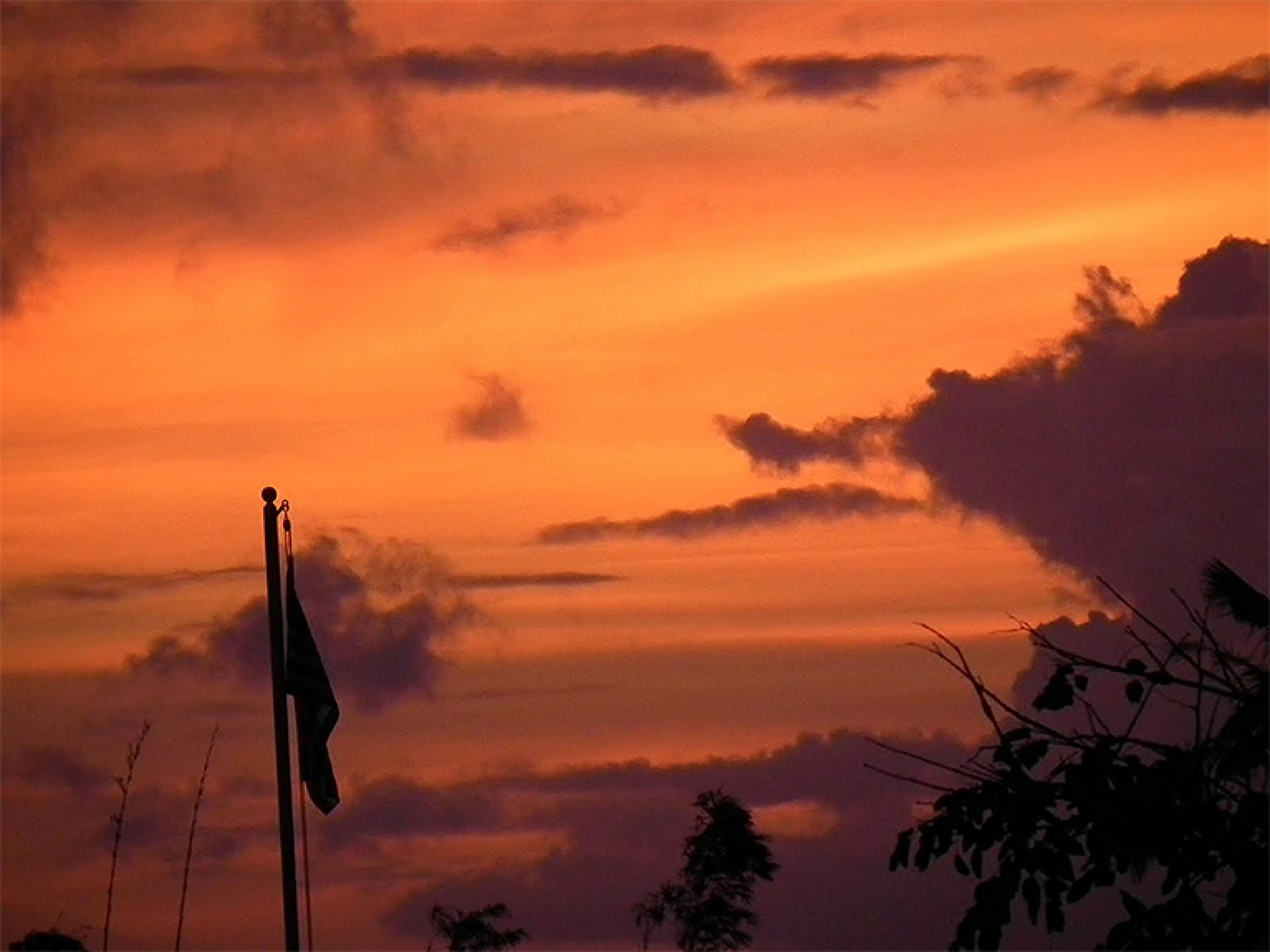 Guam flag wave in the breeze at sunset